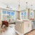 Spacious and well lit kitchen with wood flooring and stainless steel appliances at Bainbridge Market Commons in Frederick, MD